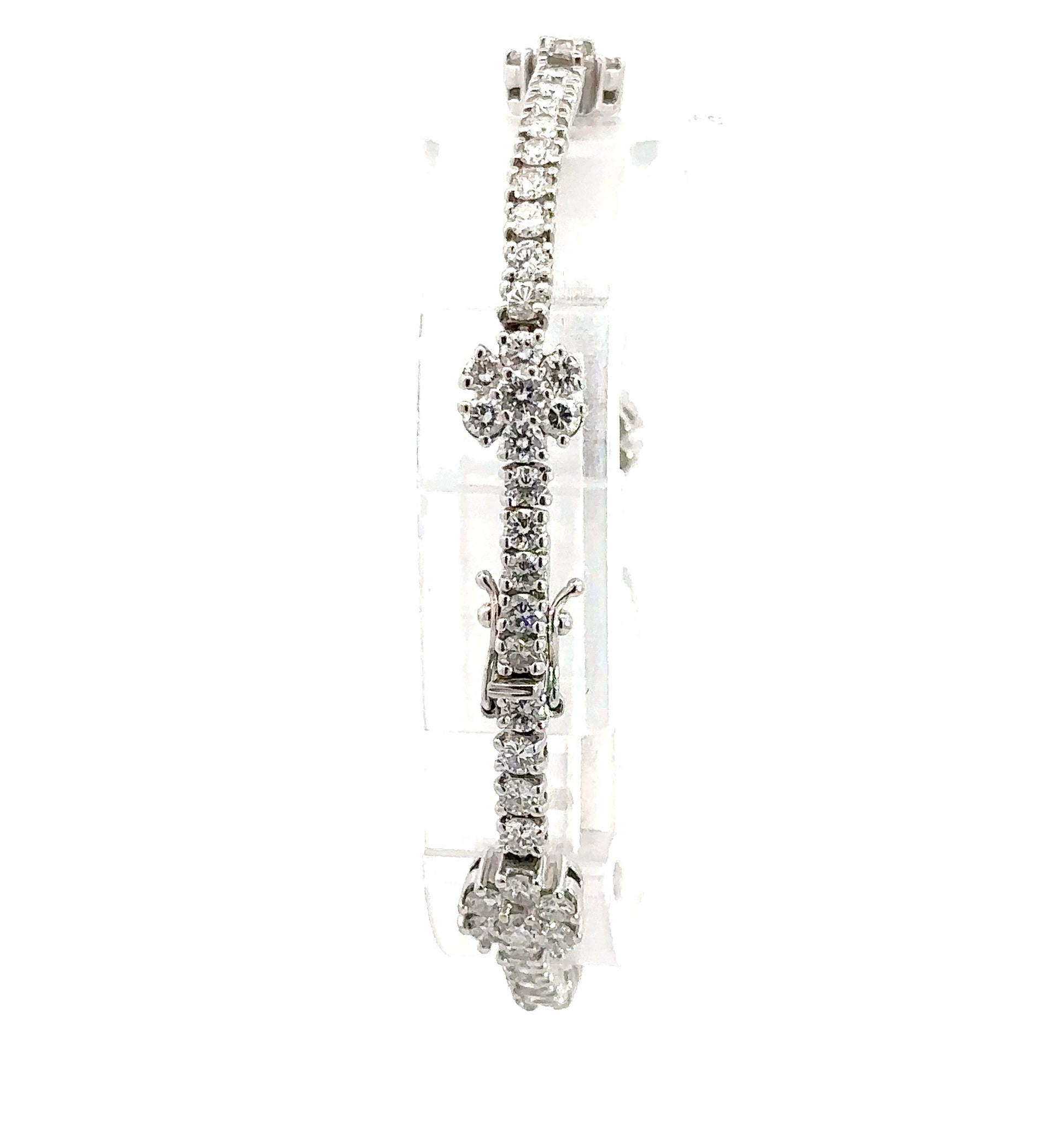 Back of diamond flower tennis bracelet with a box clasp and 2 safety locks