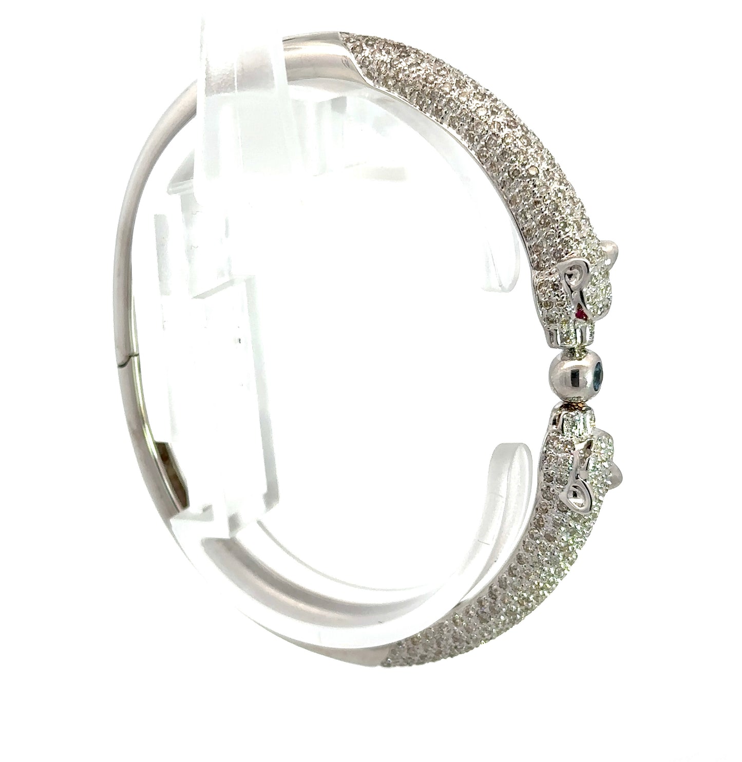 Side of white gold bangle with 2 panthers with small round diamonds on half the bracelet