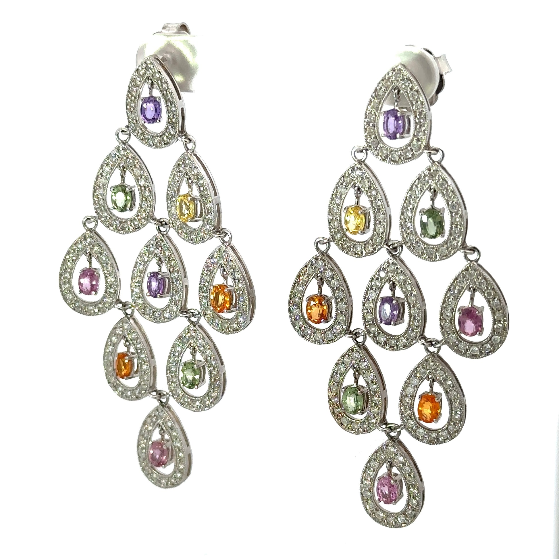 Diagonal view of white gold diamond and multi colored gemstone drop earrings