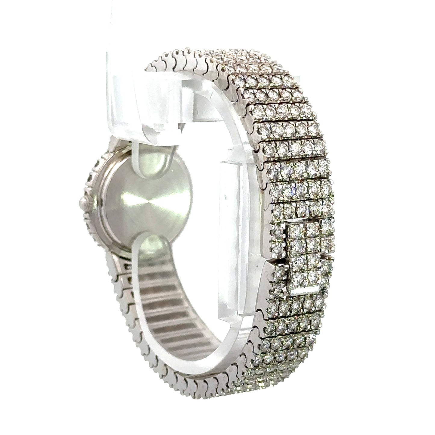 Diagonal back of diamond watch in white gold with rows of 5 round diamonds throughout the band