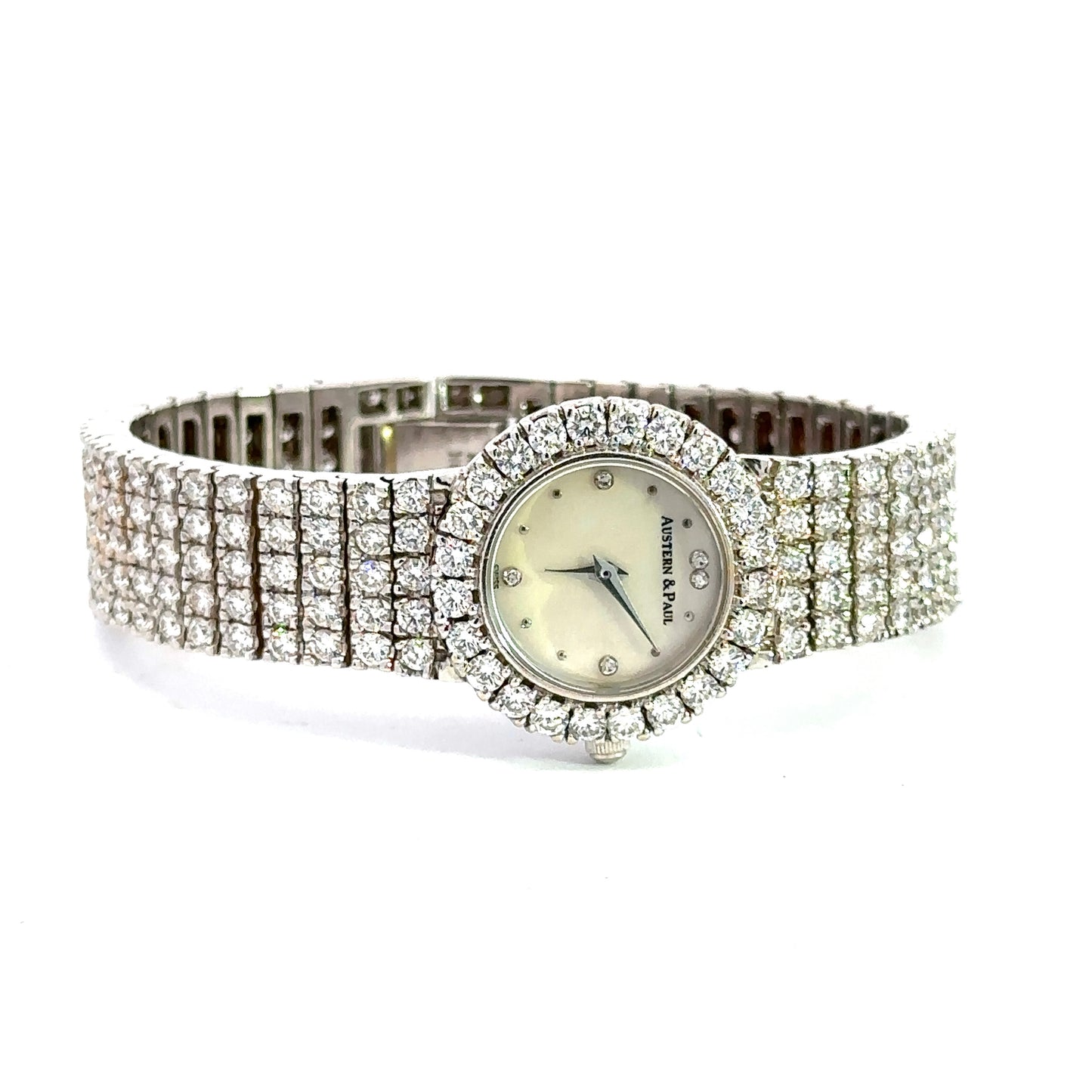 Front of watch laid on it's side with diamonds on the bezel and band
