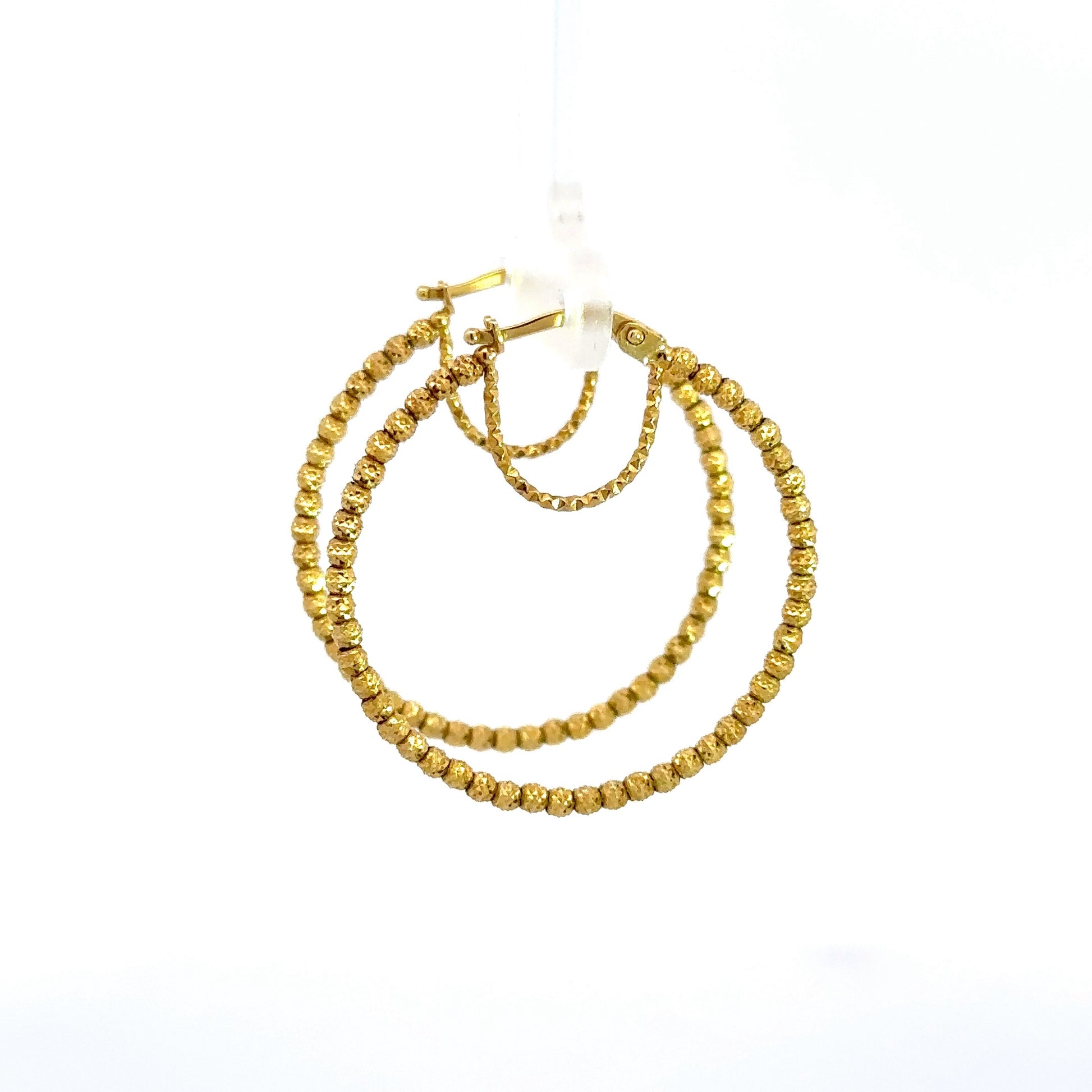 side of yellow gold hoops