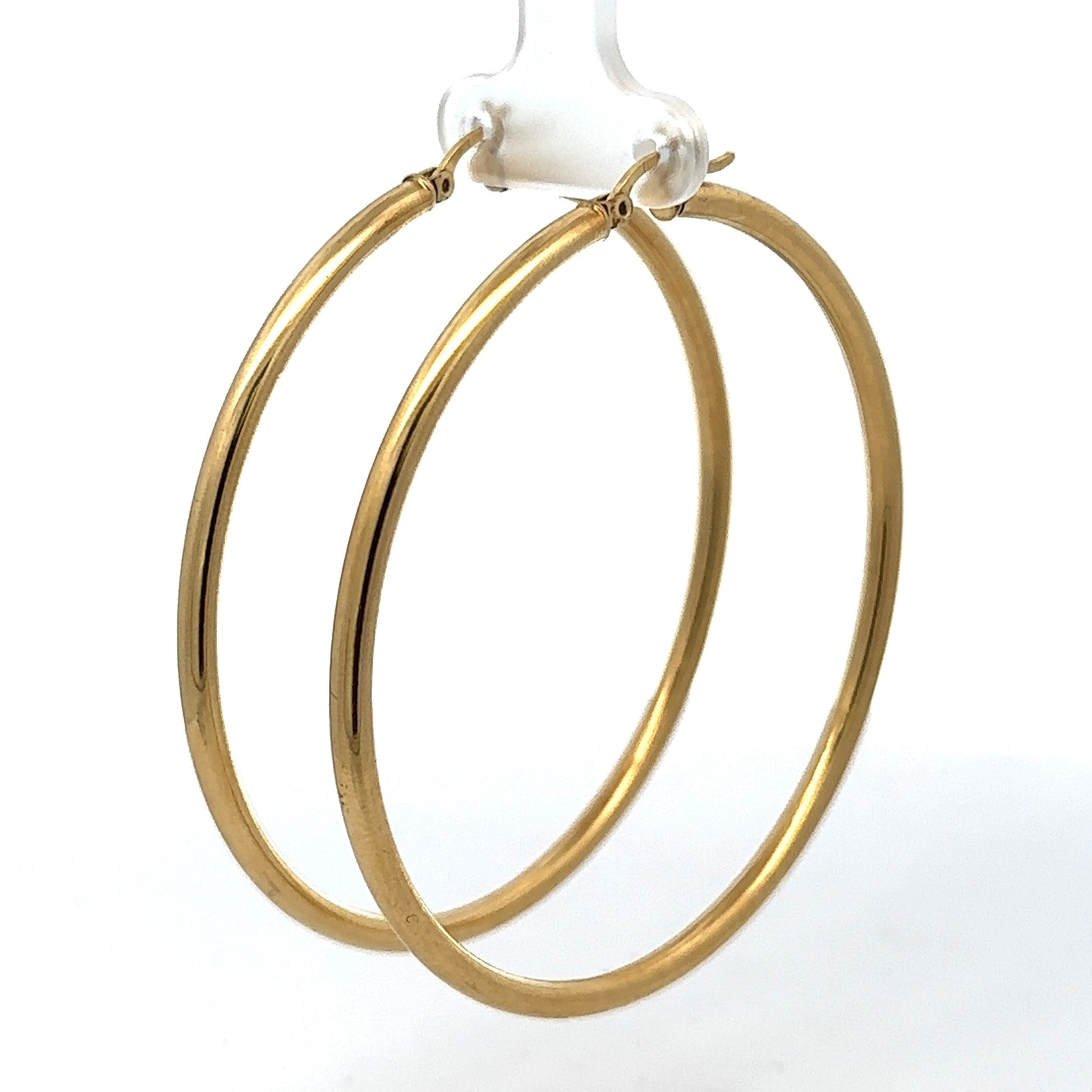 Diagonal view of yellow gold hoops
