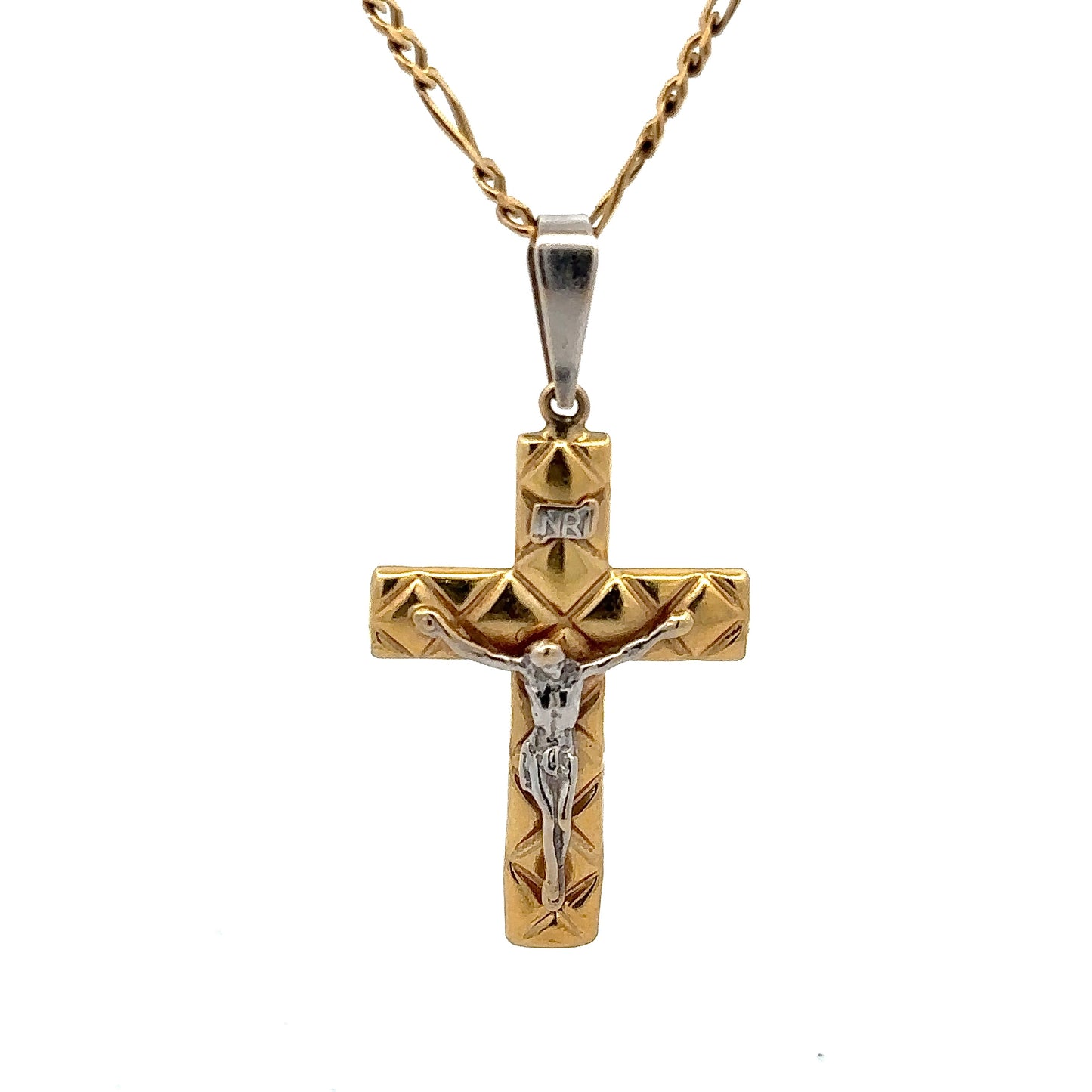 close up of yellow and white gold cross pendant