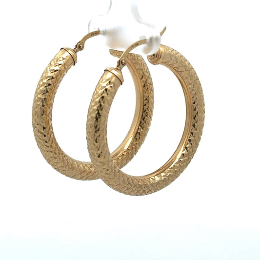yellow gold diamond cut hoops with 10K stamp on the post