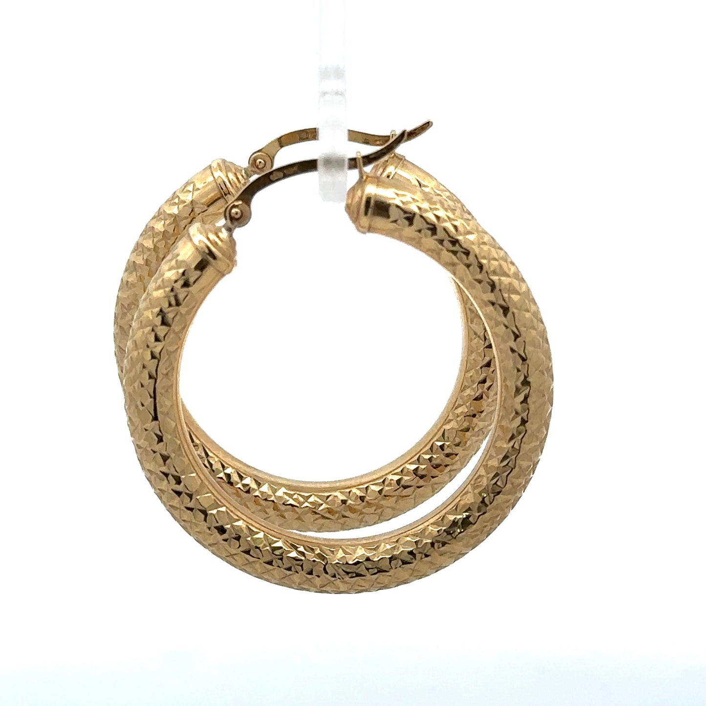side of yellow gold diamond cut hoops with 10K stamp on post