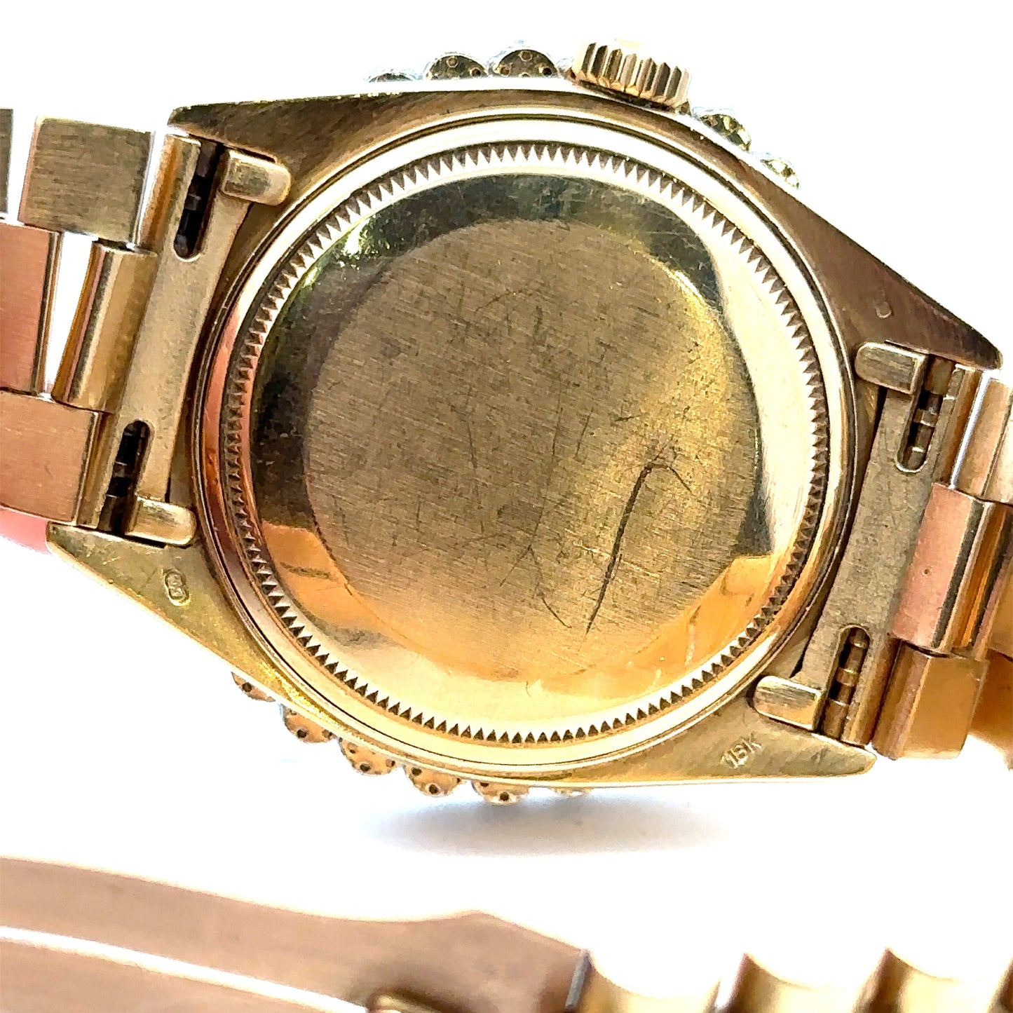 Back of Rolex case with scratches