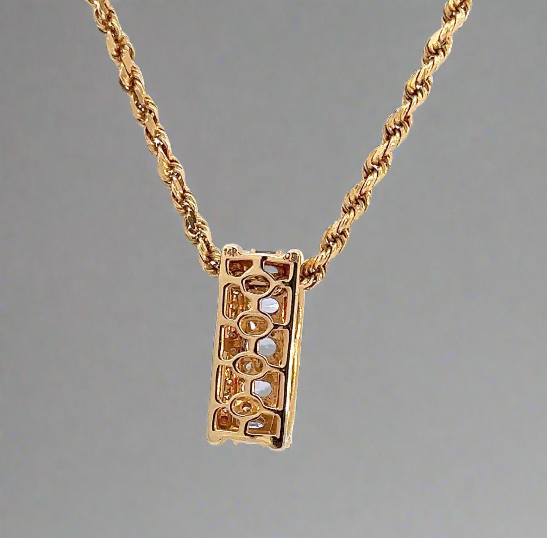 back of yellow gold pendant with 14K stamp