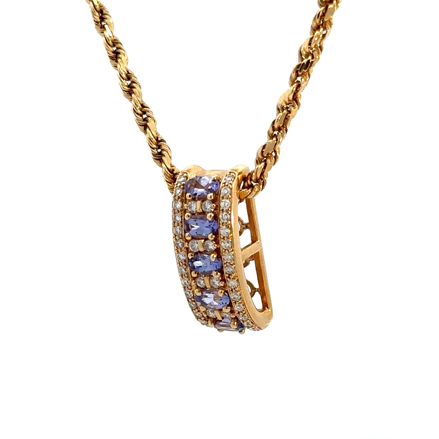 Diagonal view of yellow gold rope chain and yellow gold pendant with diamonds and tanzanite gemstones
