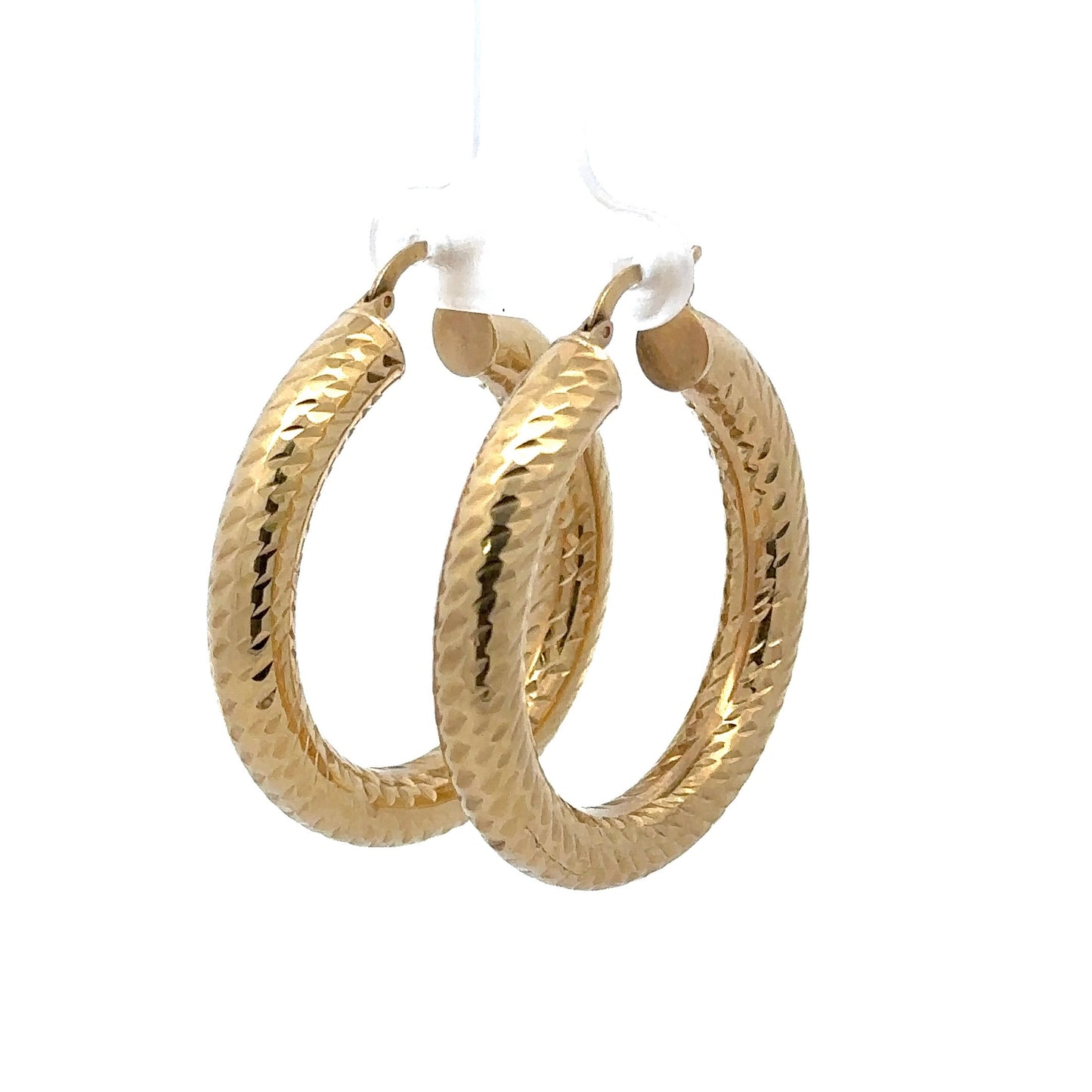 Diagonal front of yellow gold textured hoops