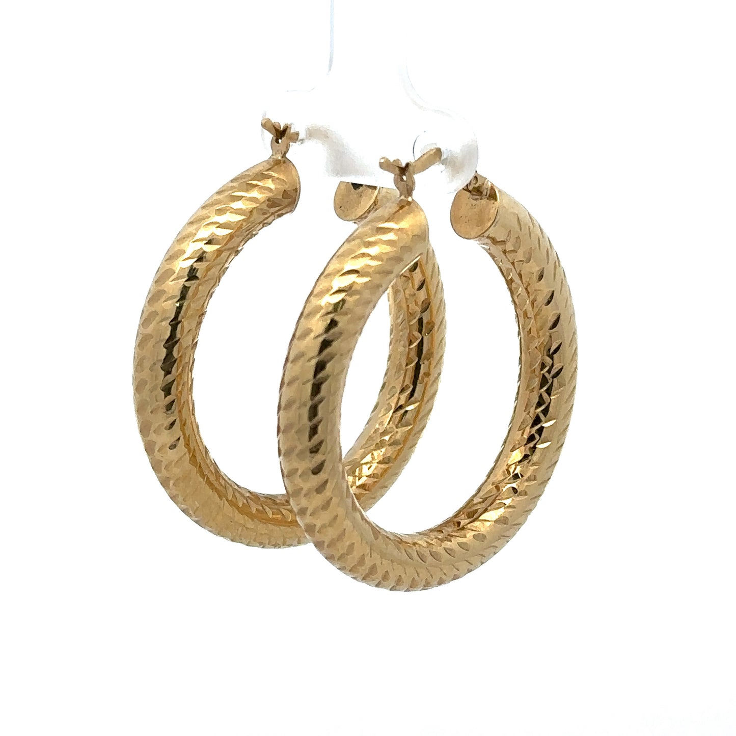 Diagonal back of yellow gold textured hoops