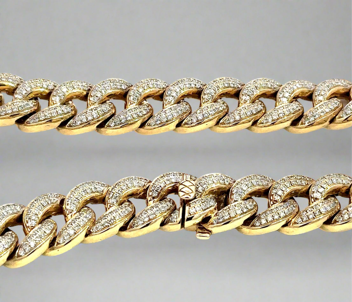 Close up view of clasp with lock and diamond cuban links