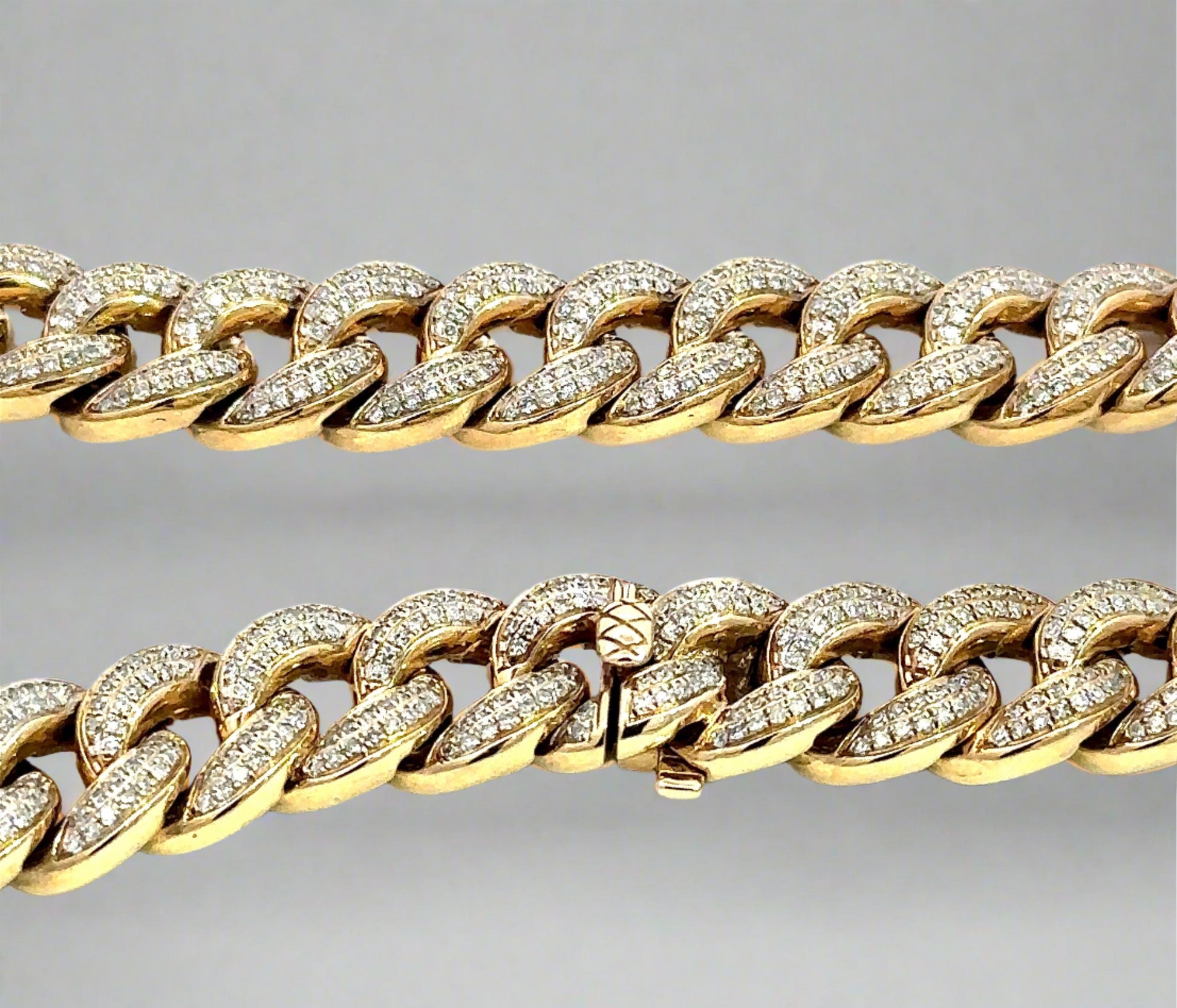 Close up view of clasp with lock and diamond cuban links