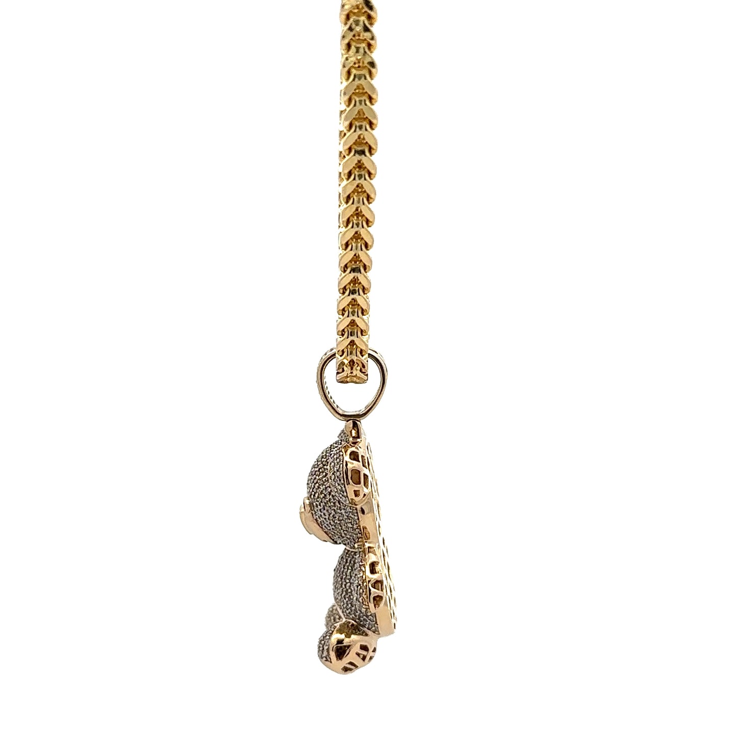 side of yellow gold chain + pendant with round baill