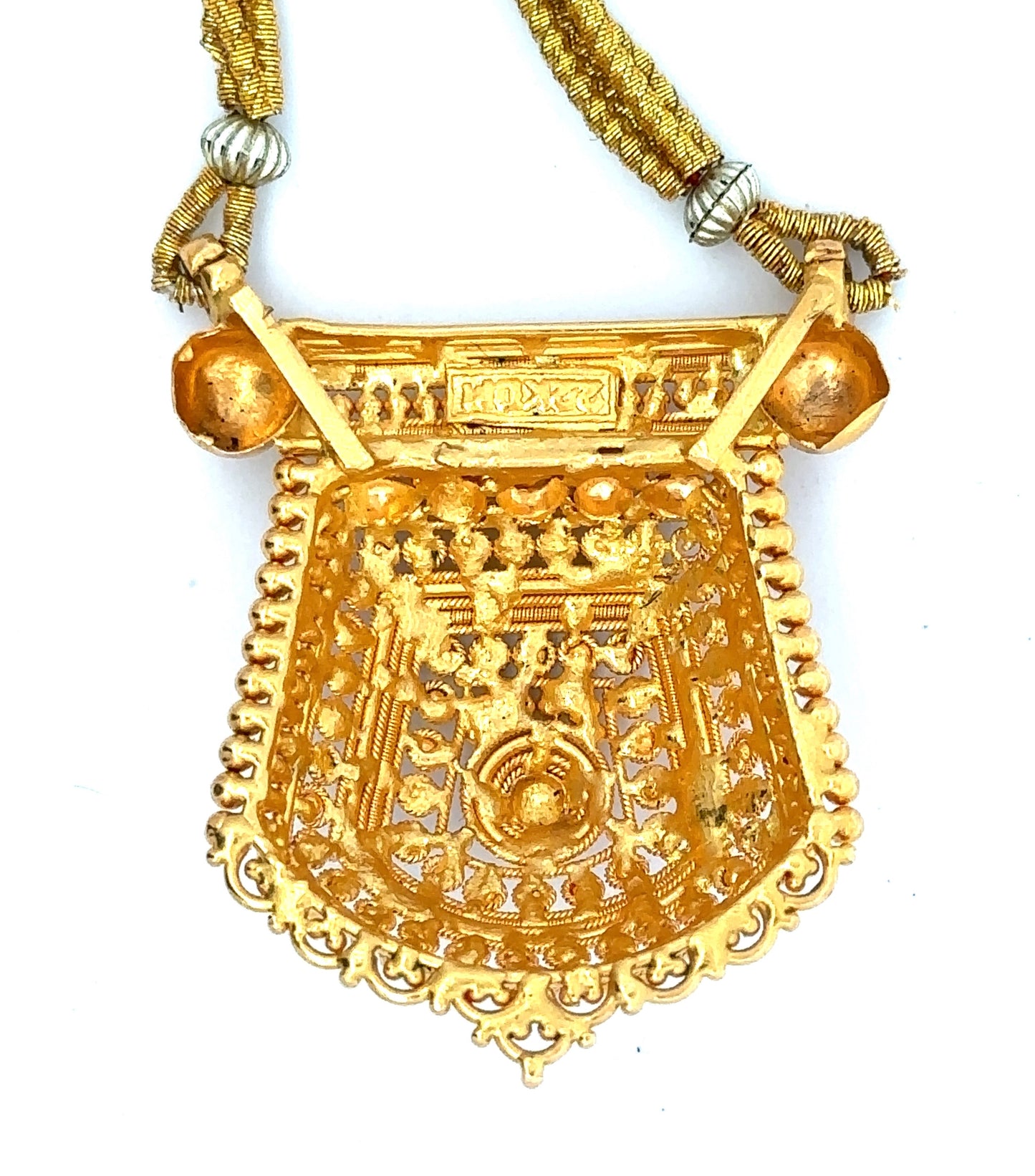 back of 22k yellow gold pendant with 22k stamp on top