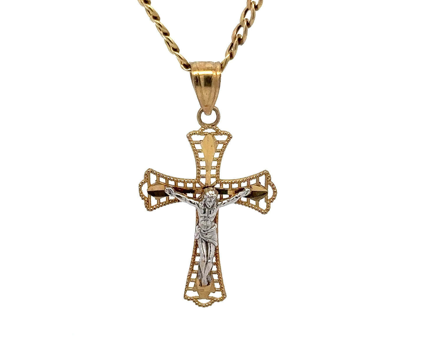 close up of yellow gold cross with a white gold jesus