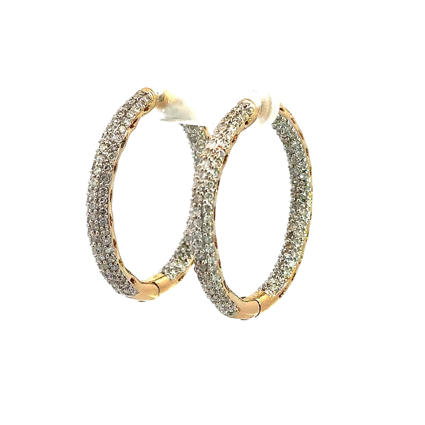 Diagonal view of diamond hoop earrings in yellow gold with 3 rows of round small diamonds outside on front and inside of hoops