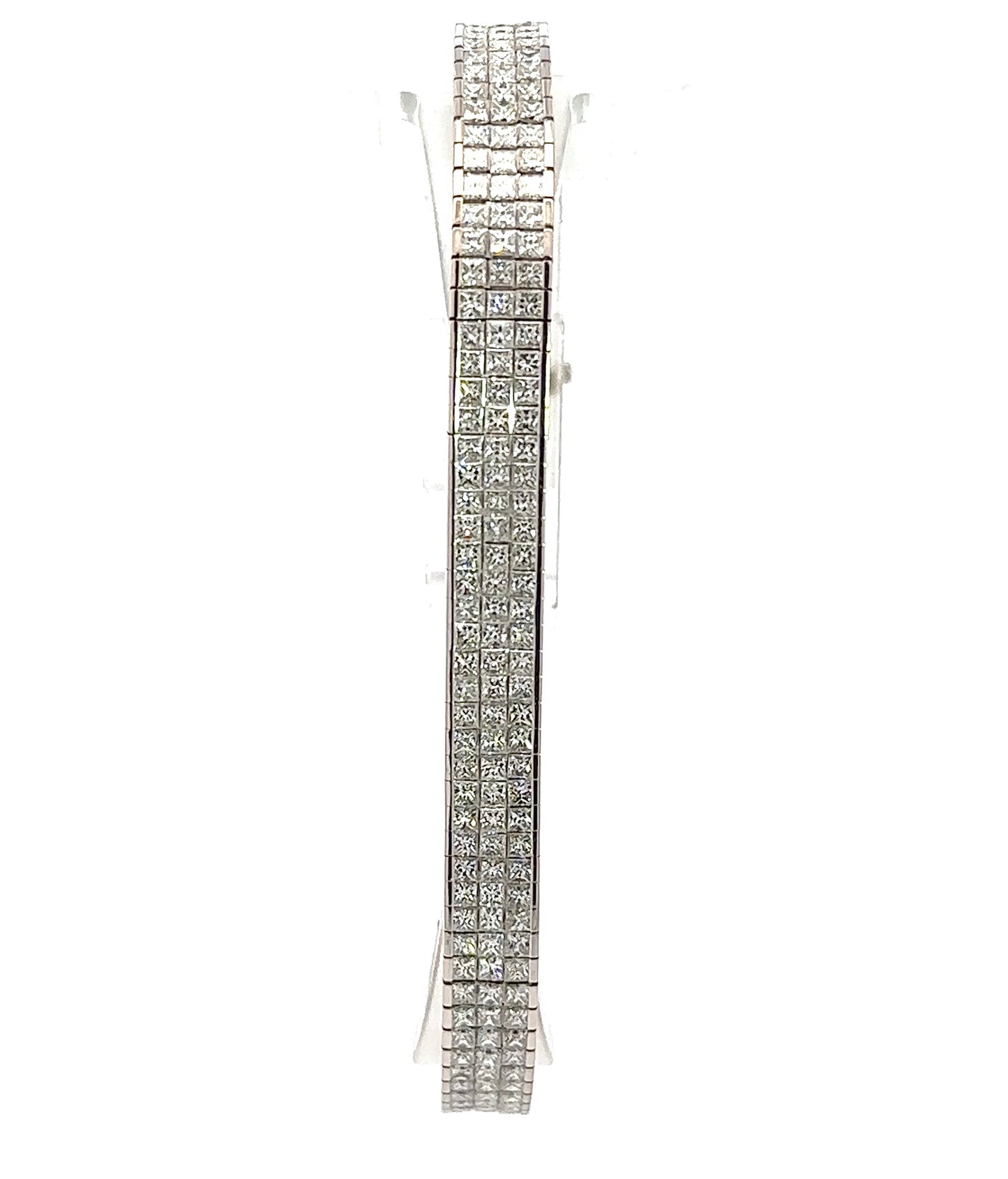 Front of white gold tennis bracelet with rows of 3 princess-cut diamonds