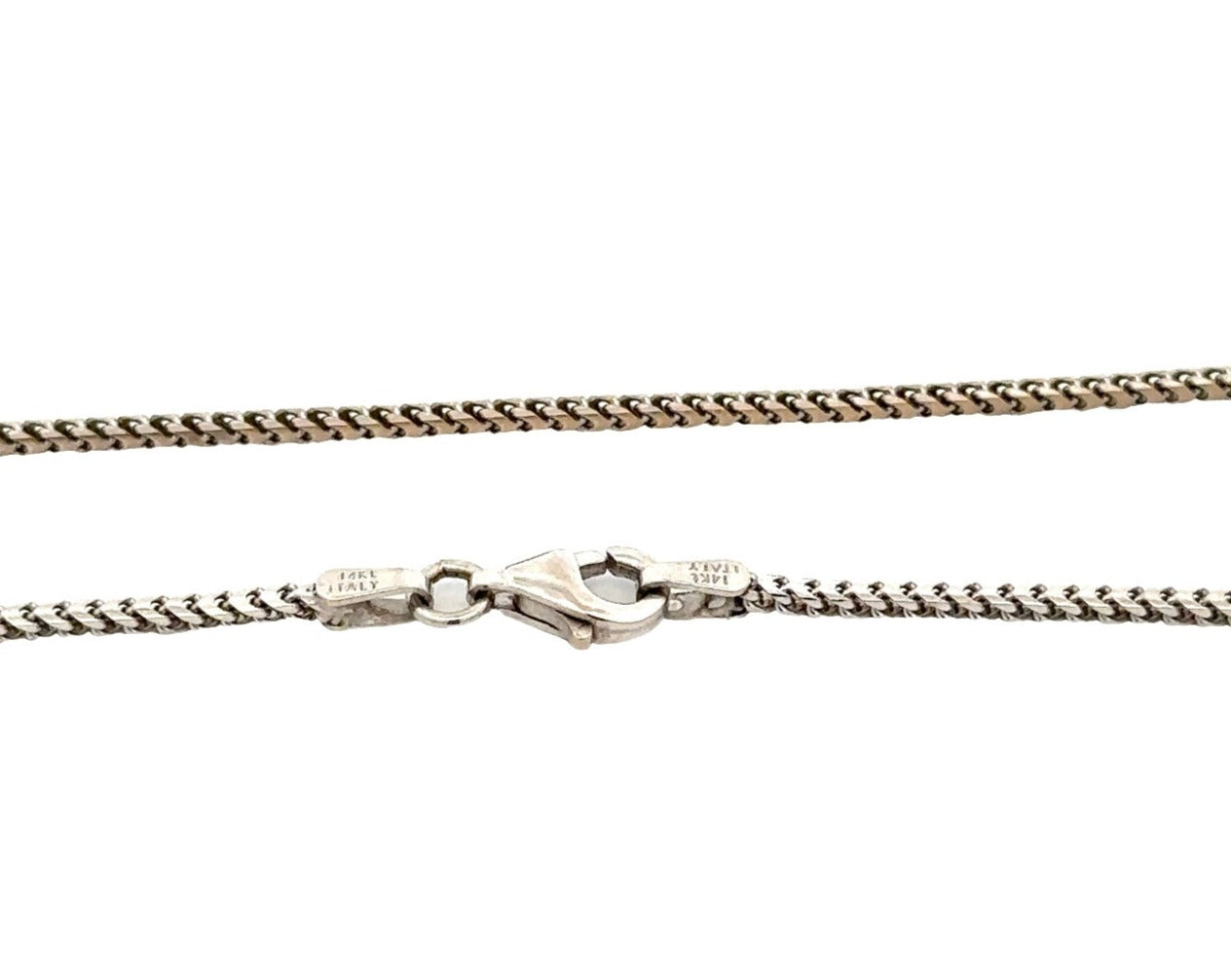 close up of white gold round franco chain with 14K stamp on lobster clasp
