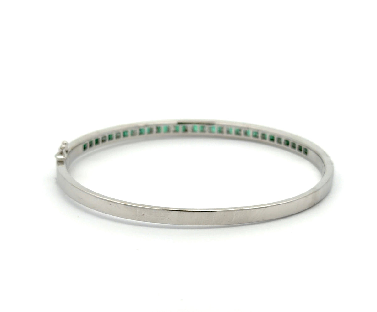 Back of white gold bangle bracelet with no stones on the back