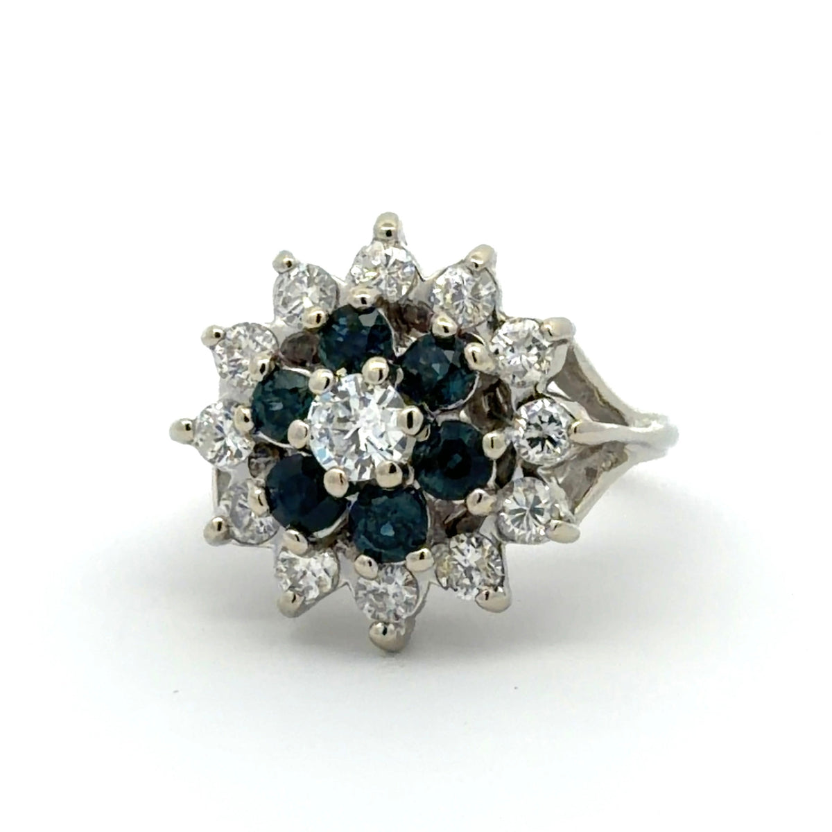 White gold ring with blue gemstones and diamonds on a white background