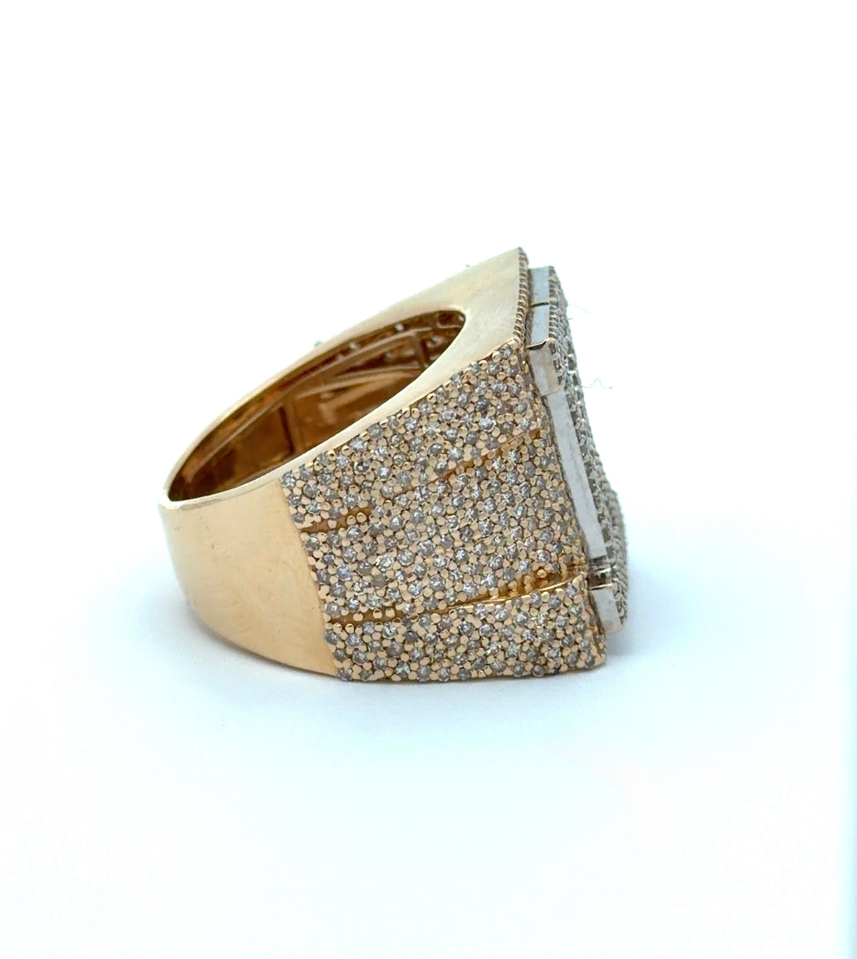 Gold ring with diamond accents on a white background