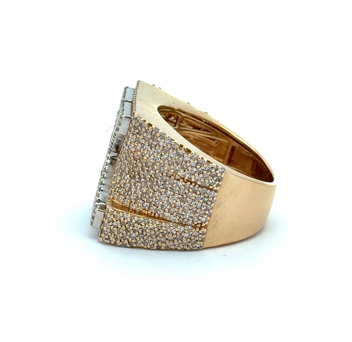 Gold ring with diamond accents on a white background