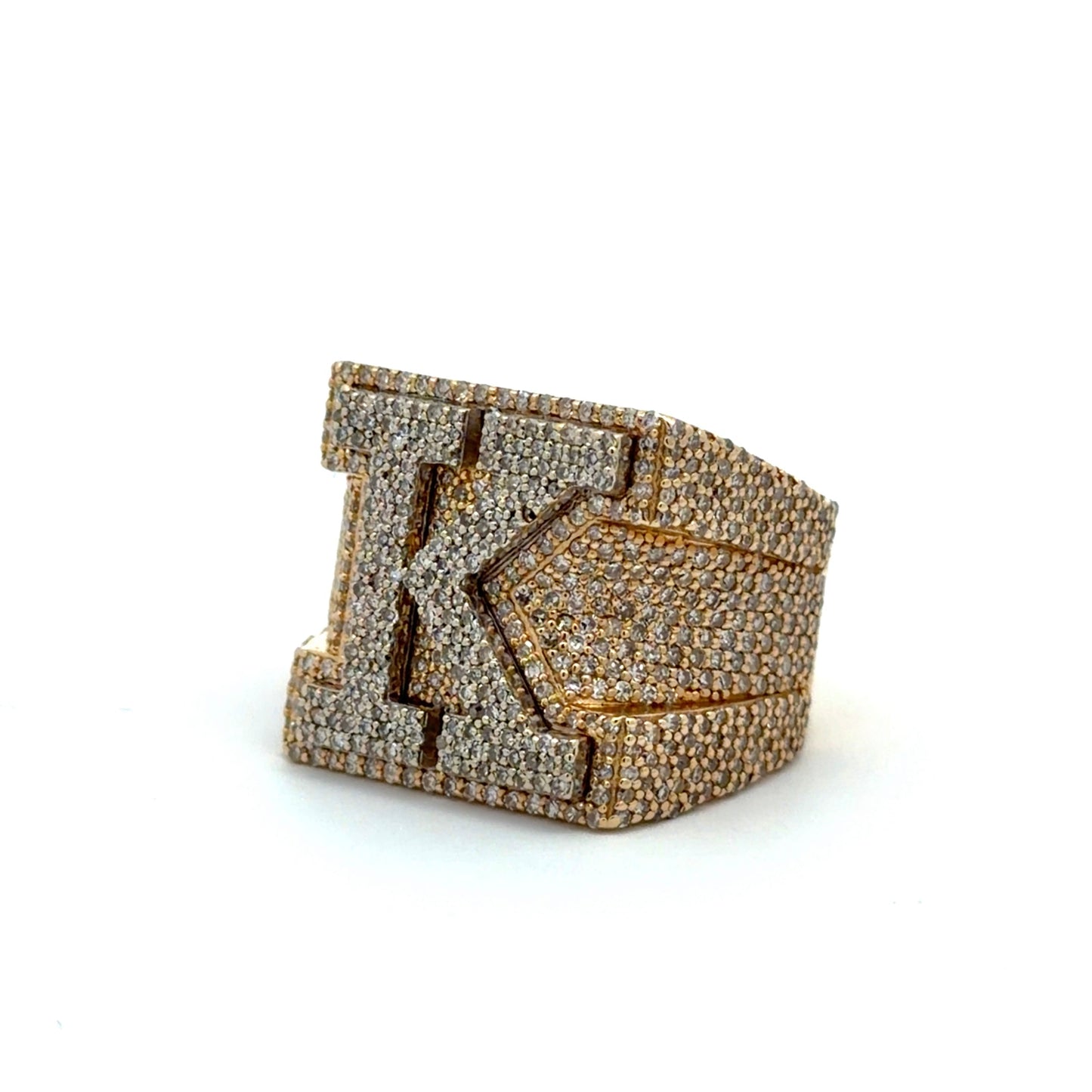 Gold and diamond ring with a prominent K
