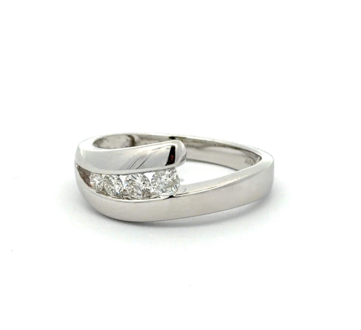 Diagonal view of white gold ring with 4 natural round diamonds on a white background