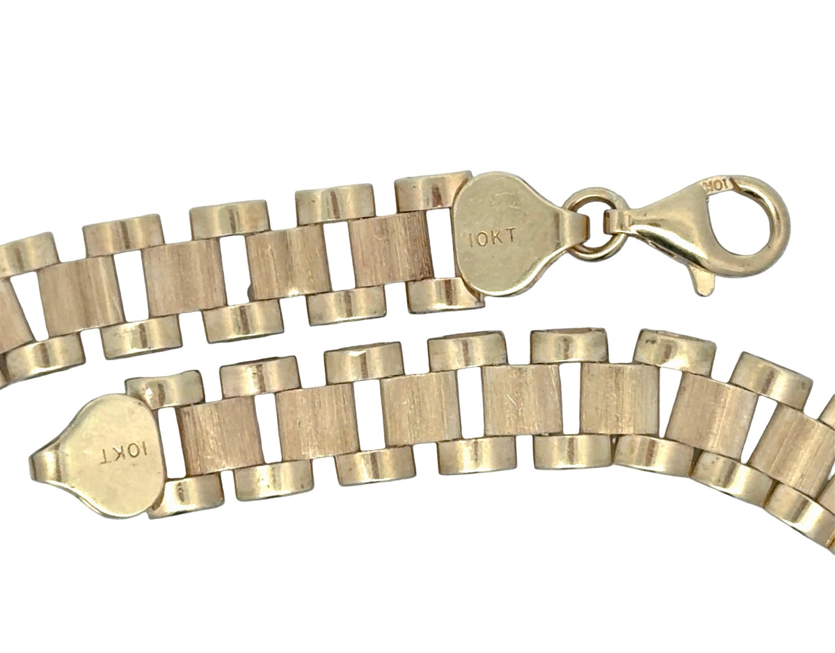 A 10K yellow gold lobster clasp shown on a plain white background.