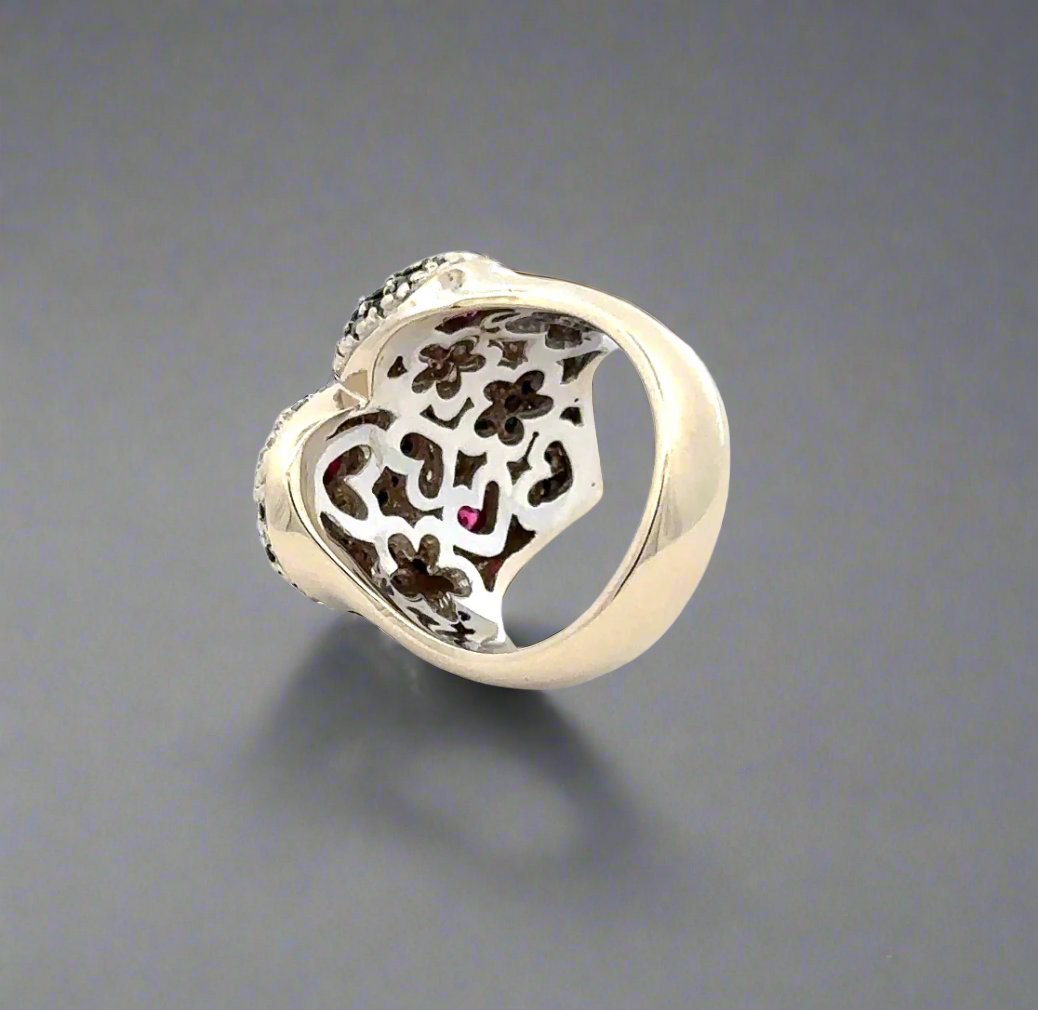 Back of white gold ring with heart and floral detailing on the inside