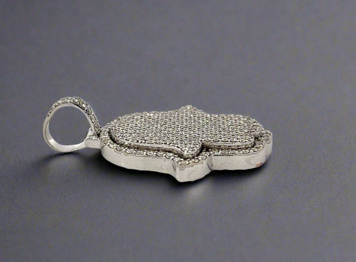 Side of pendant with marks on gold