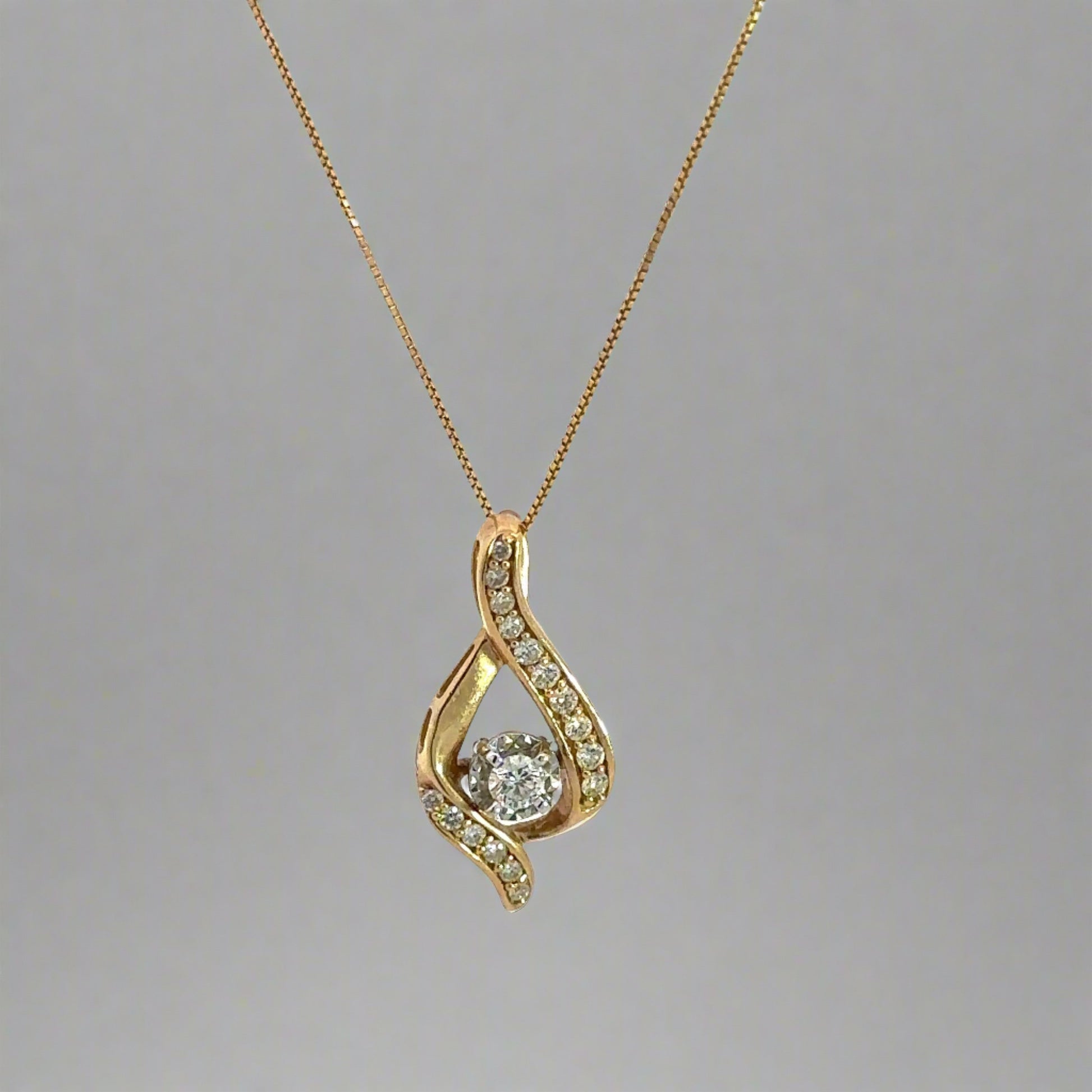 Yellow Gold thin box chain with yellow + white gold diamond pendant with 1 round diamond in the center + 16 small round diamonds on yellow gold in teardrop shape