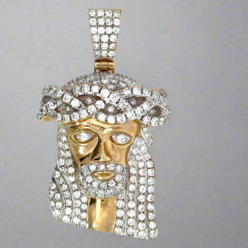 Front of the 10K Diamond Jesus pendant. Diamonds cover the hair, eyes, facial hair, top of the head, and barrel.
