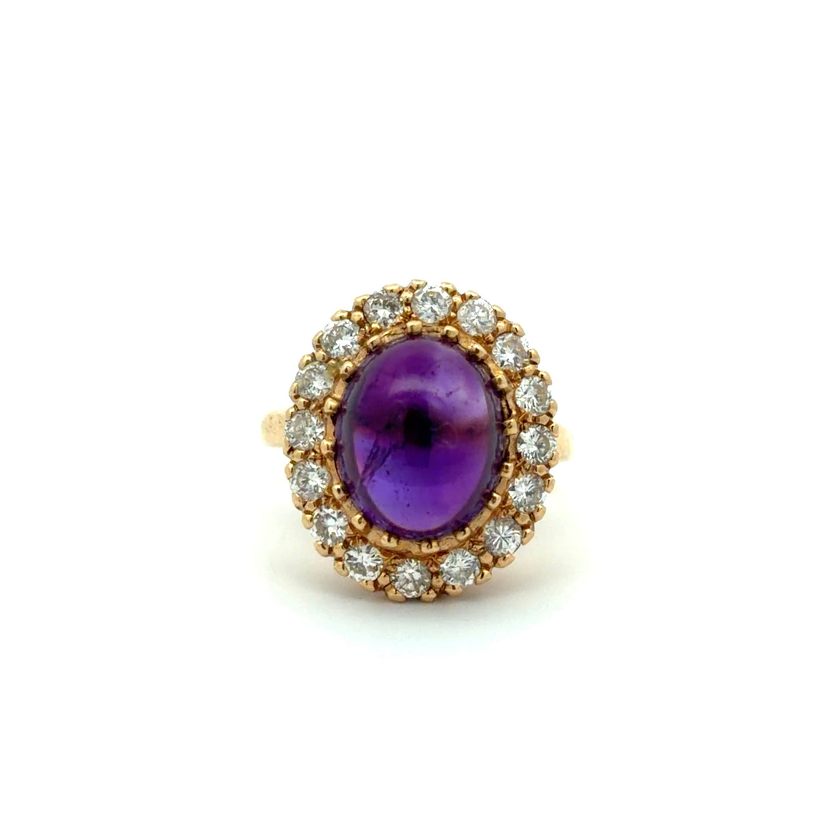 Purple Amethyst cabochon and diamond ring on white background