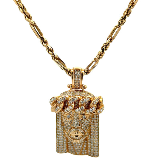hanging yellow gold milano rope chain with a diamond jesus head pendant in yellow gold