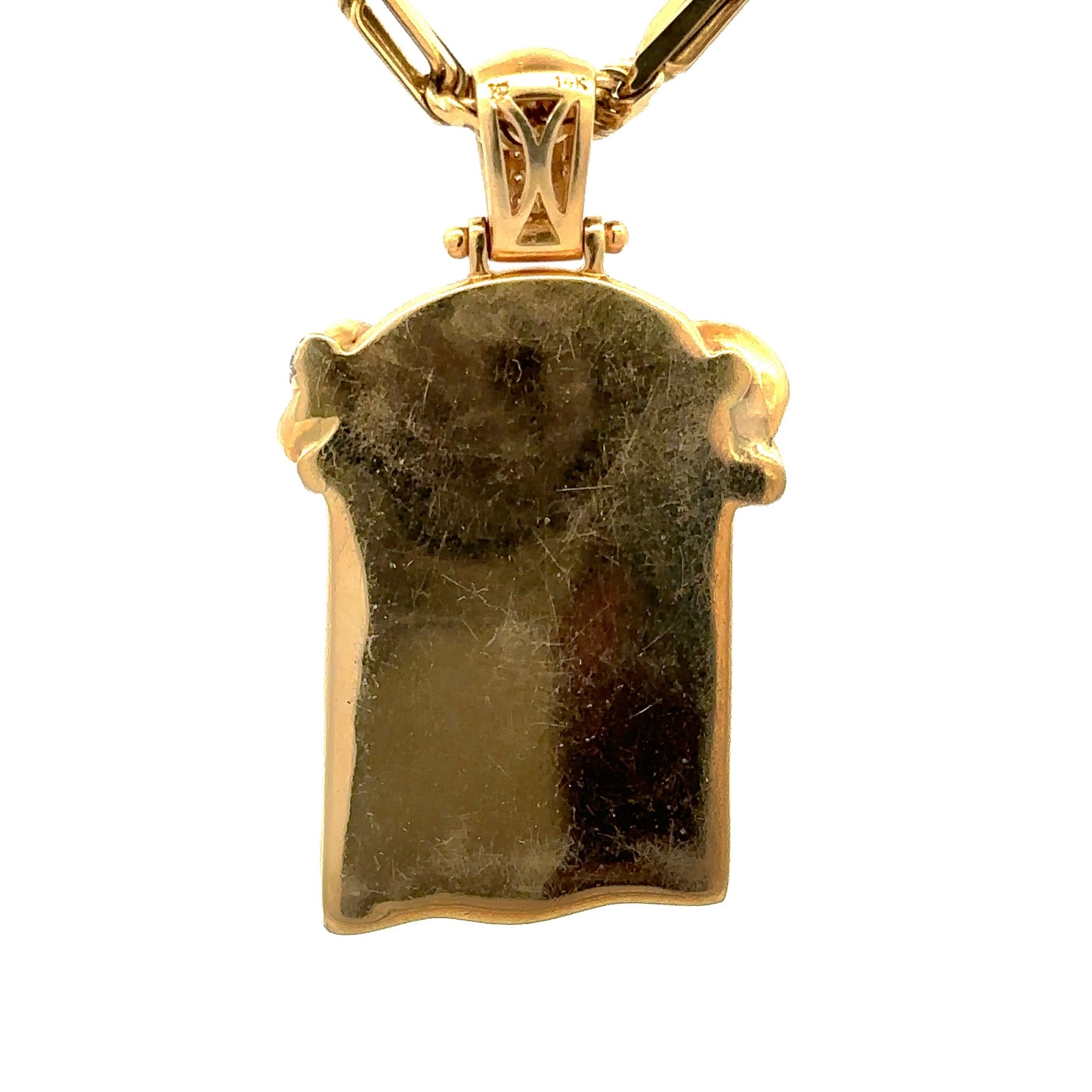 back of yellow gold pendant with scratches on gold. 14K stamp on bail