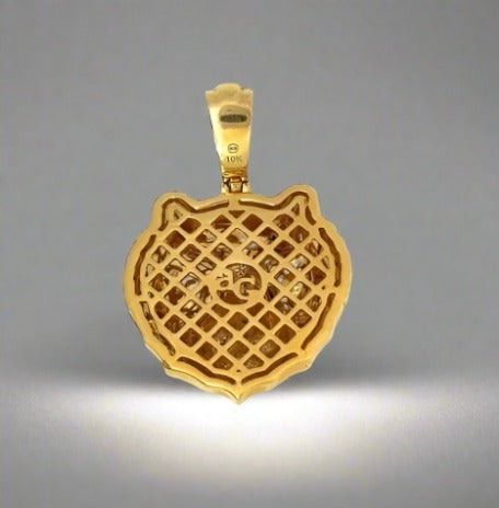 Back of tiger pendant. Open bag with "ag" and 10K stamp on barrel. Scratches on gold.