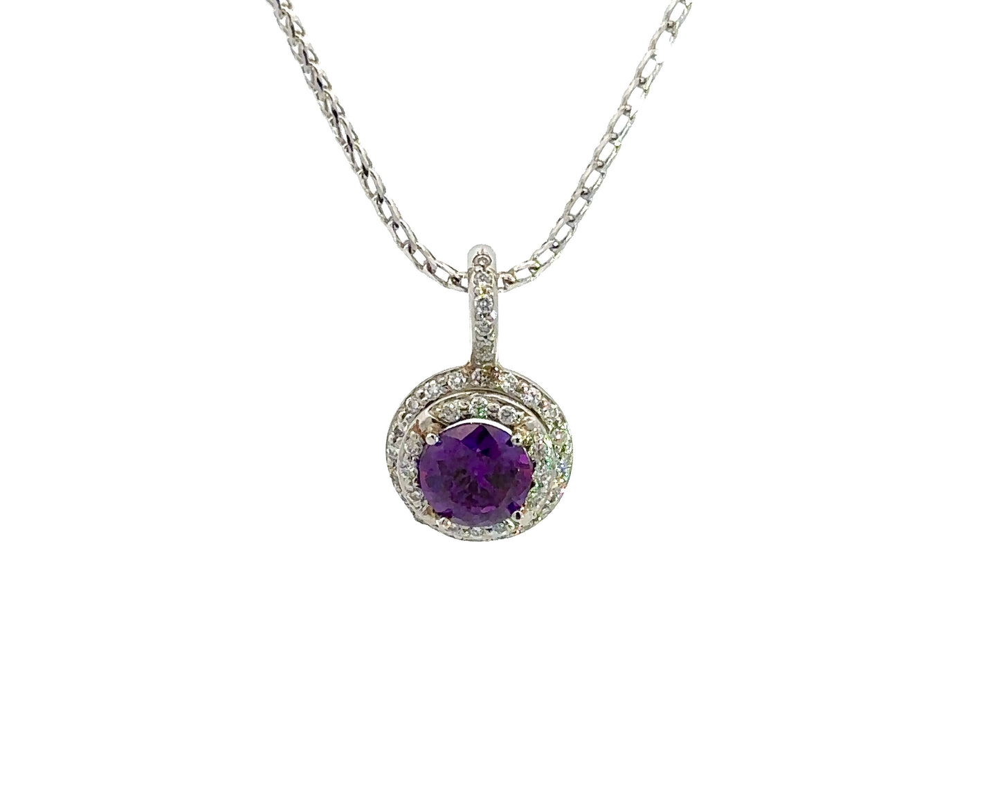 front of diamond and amethyst necklace with 1 large round amethyst purple gemstone in center and 2 rows of diamonds around amethyst