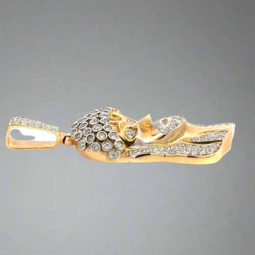 Side of the diamond Jesus pendant. Light scratches on gold. Square bail.