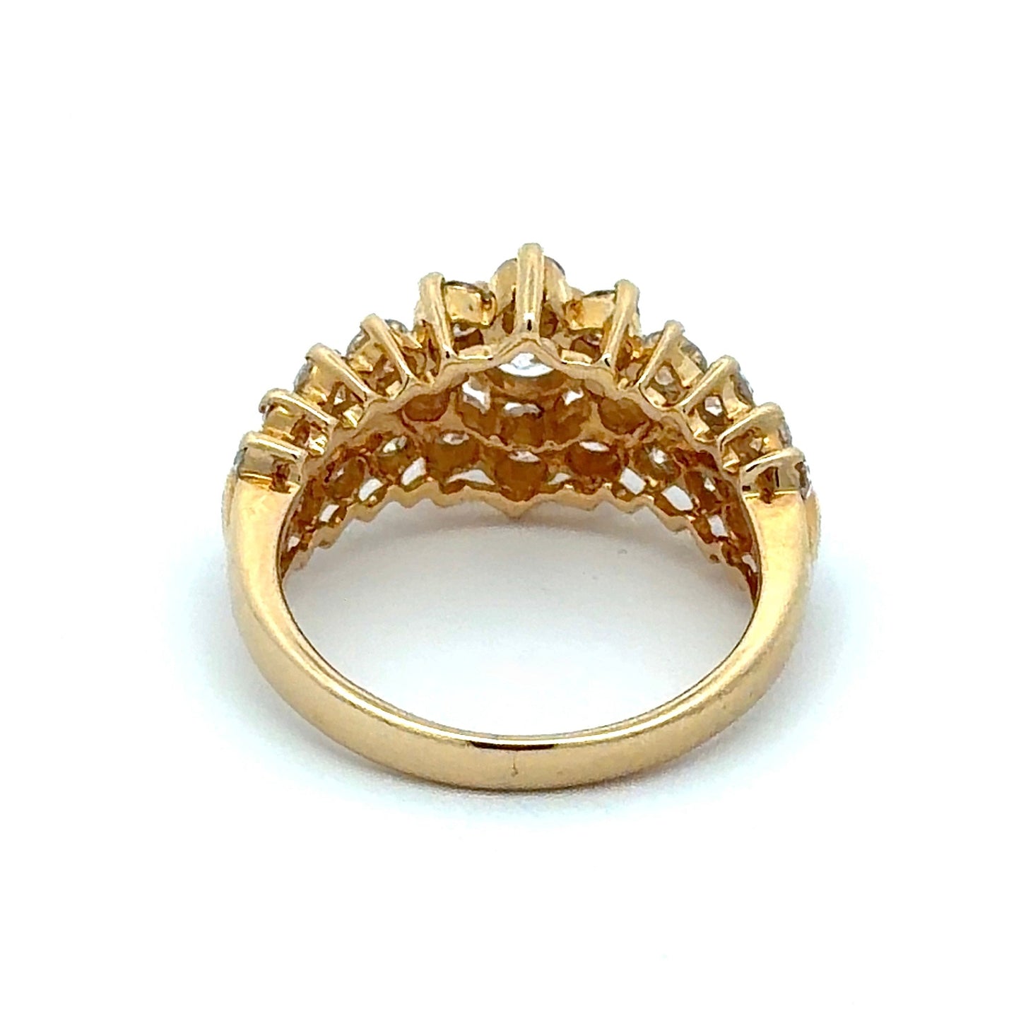 Gold ring with a decorative design on a white background