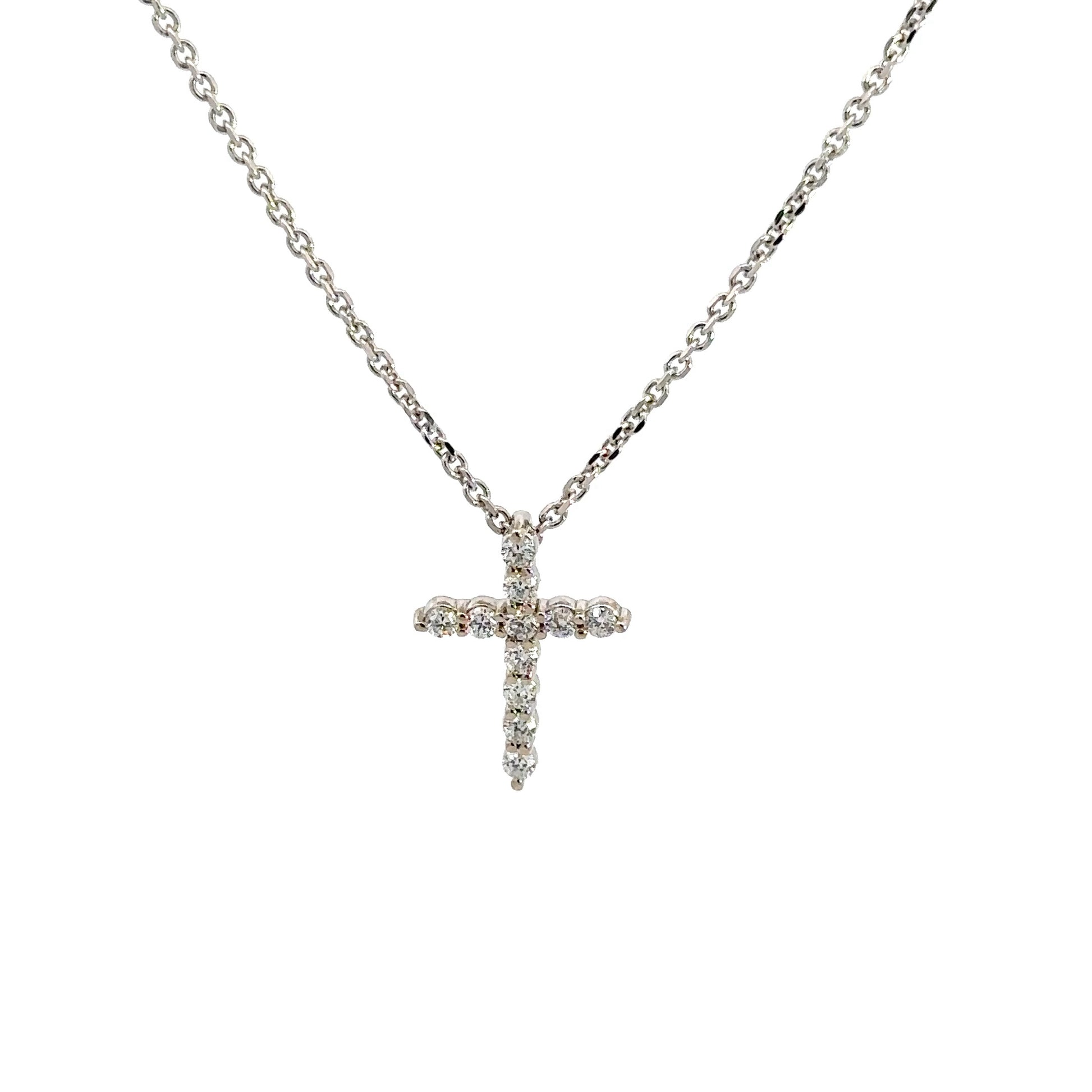 front of diamond cross in white gold with thin link chain
