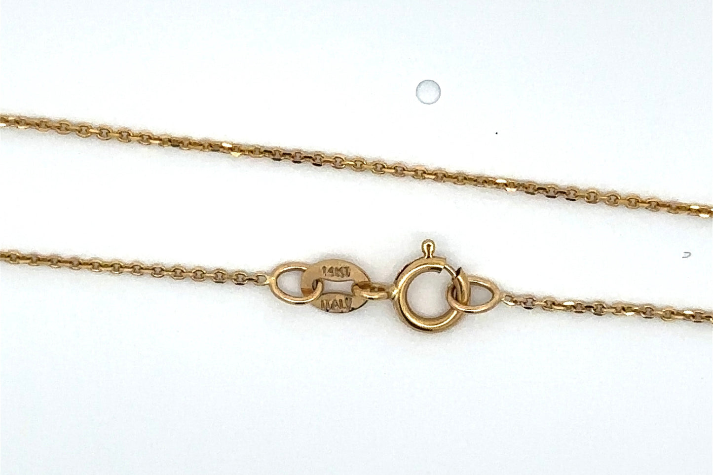 Gold chain necklace on a white background with 14K stamp