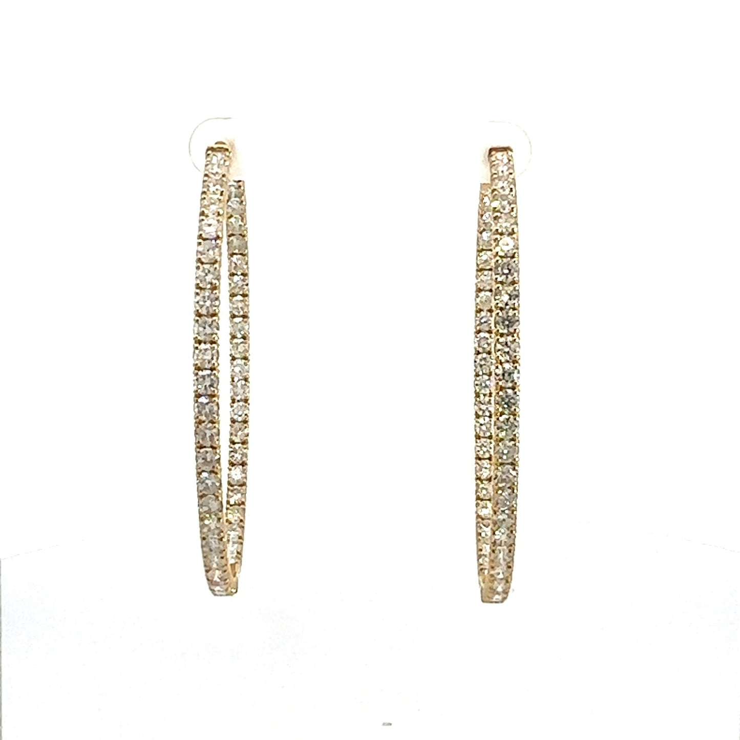 Front of yellow gold diamond hoops with diamonds on front and inside of hoops