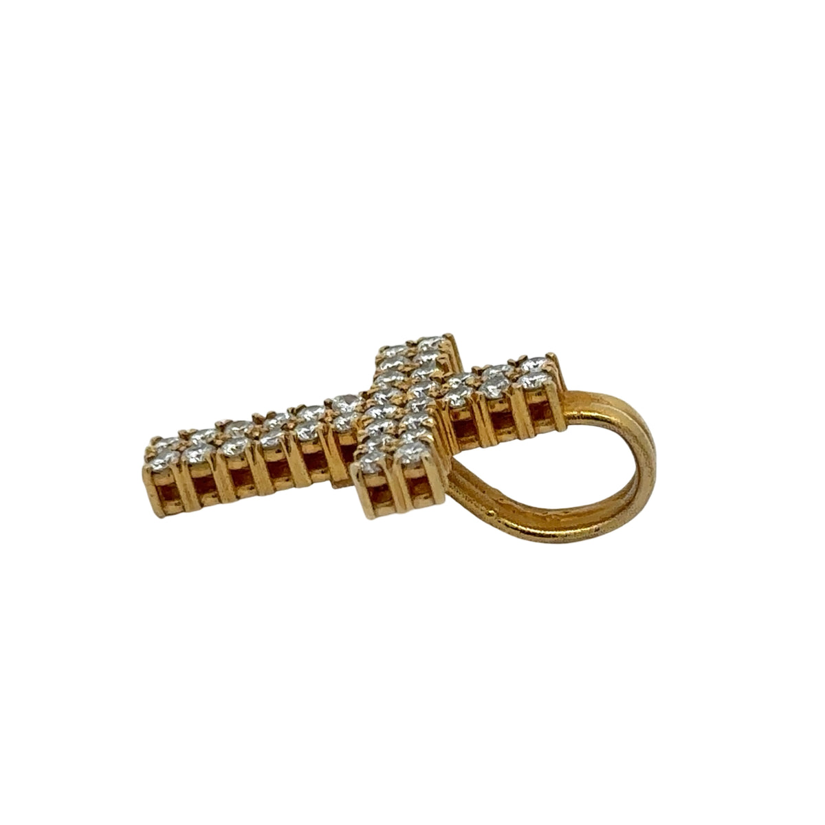 Side of gold cross pendant