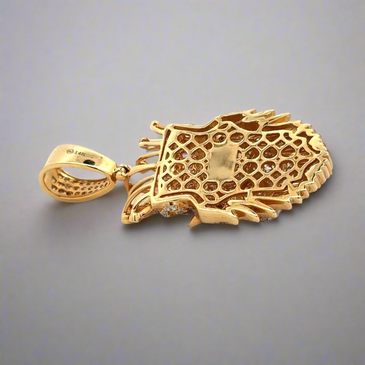 Back of lion pendant in yellow gold with 14K stamp