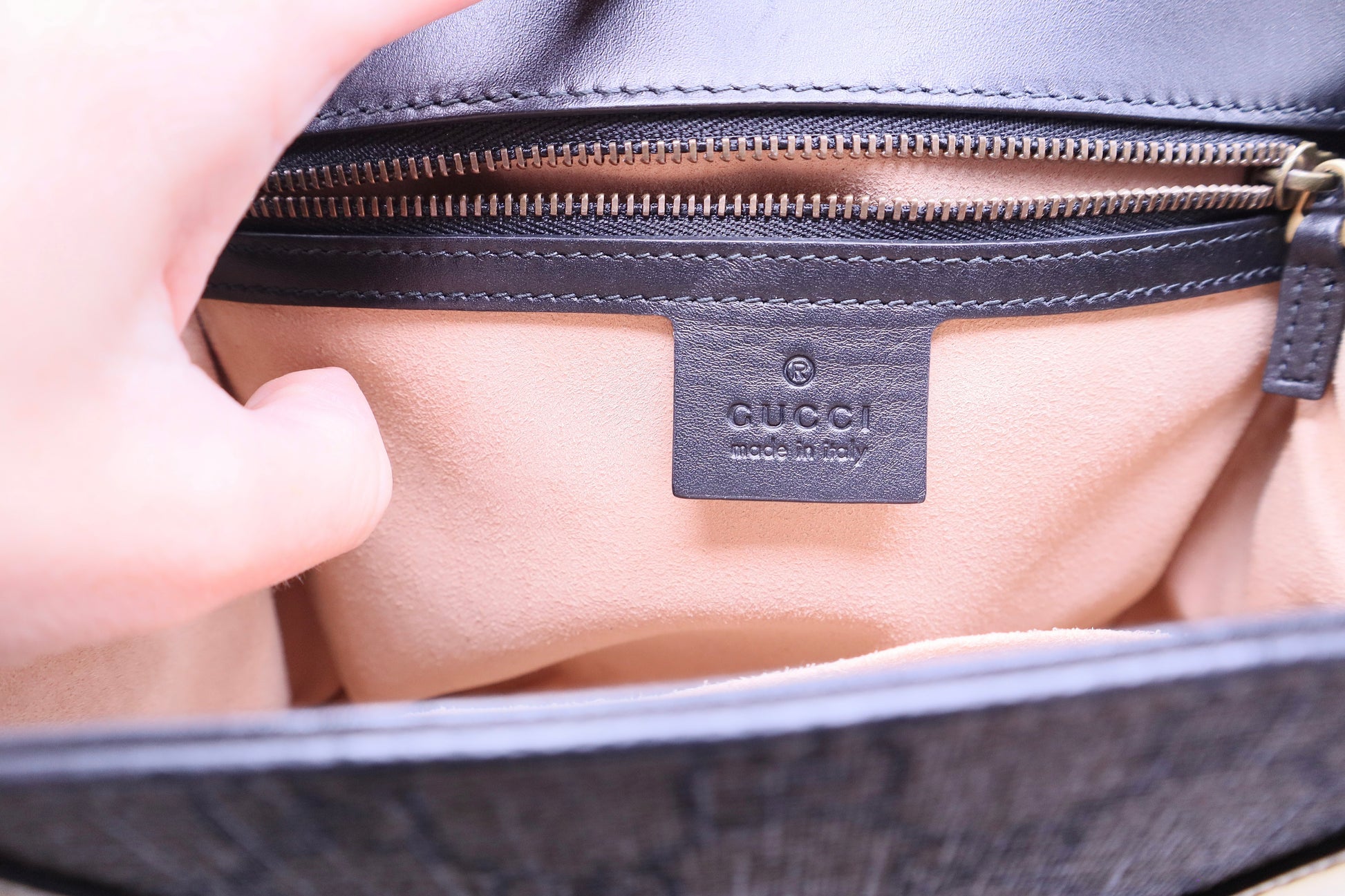 Gucci leather logo on interior of bag