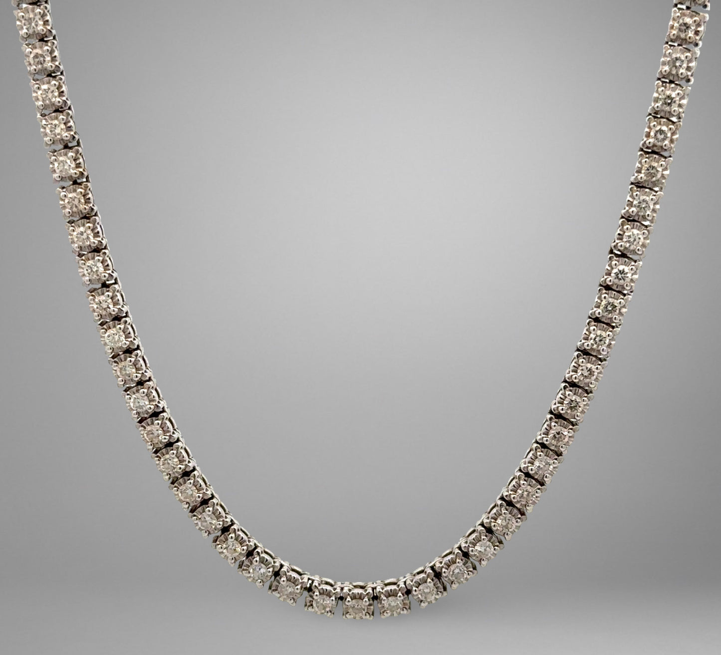 Diamond necklace on a gray background