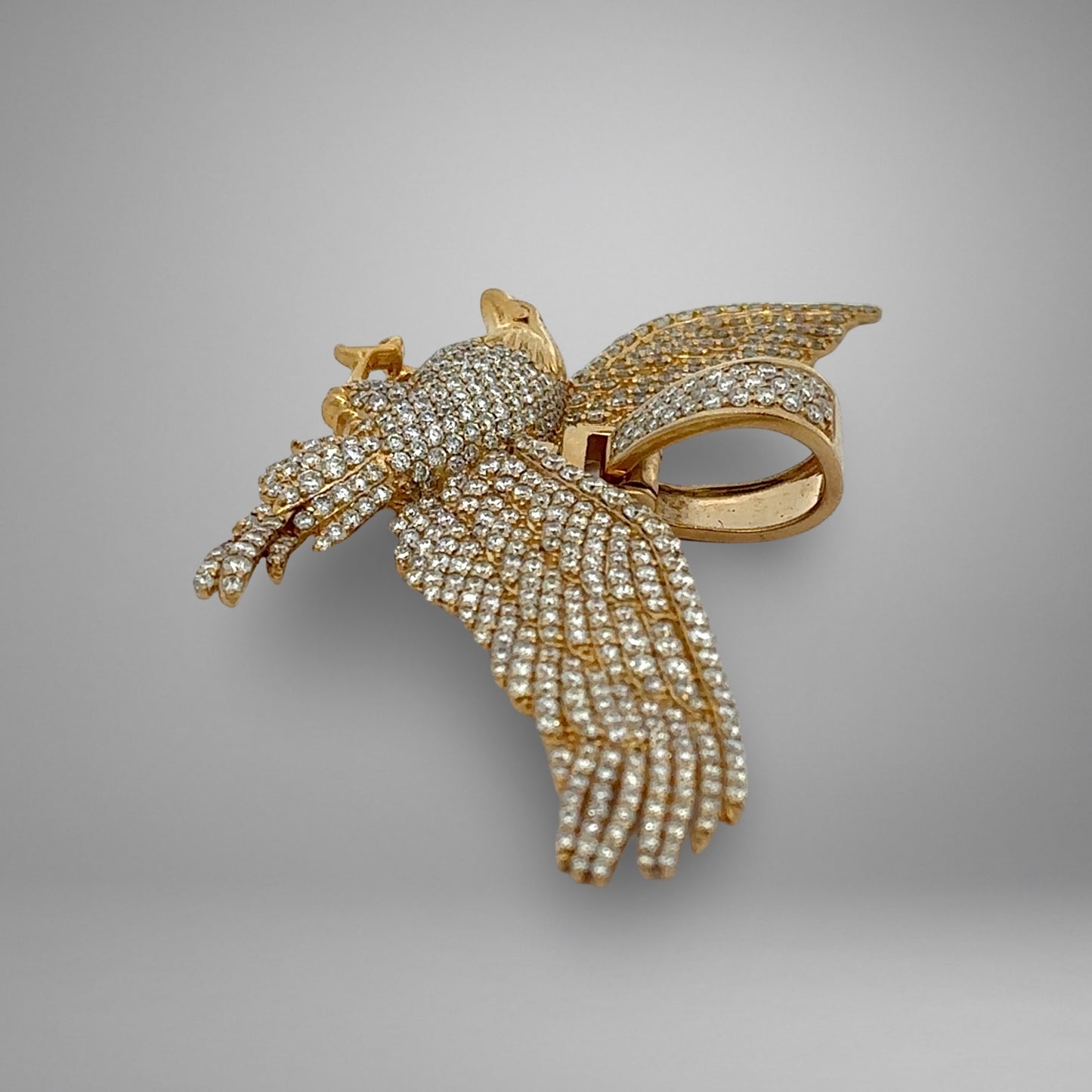 Gold and diamond eagle pendant