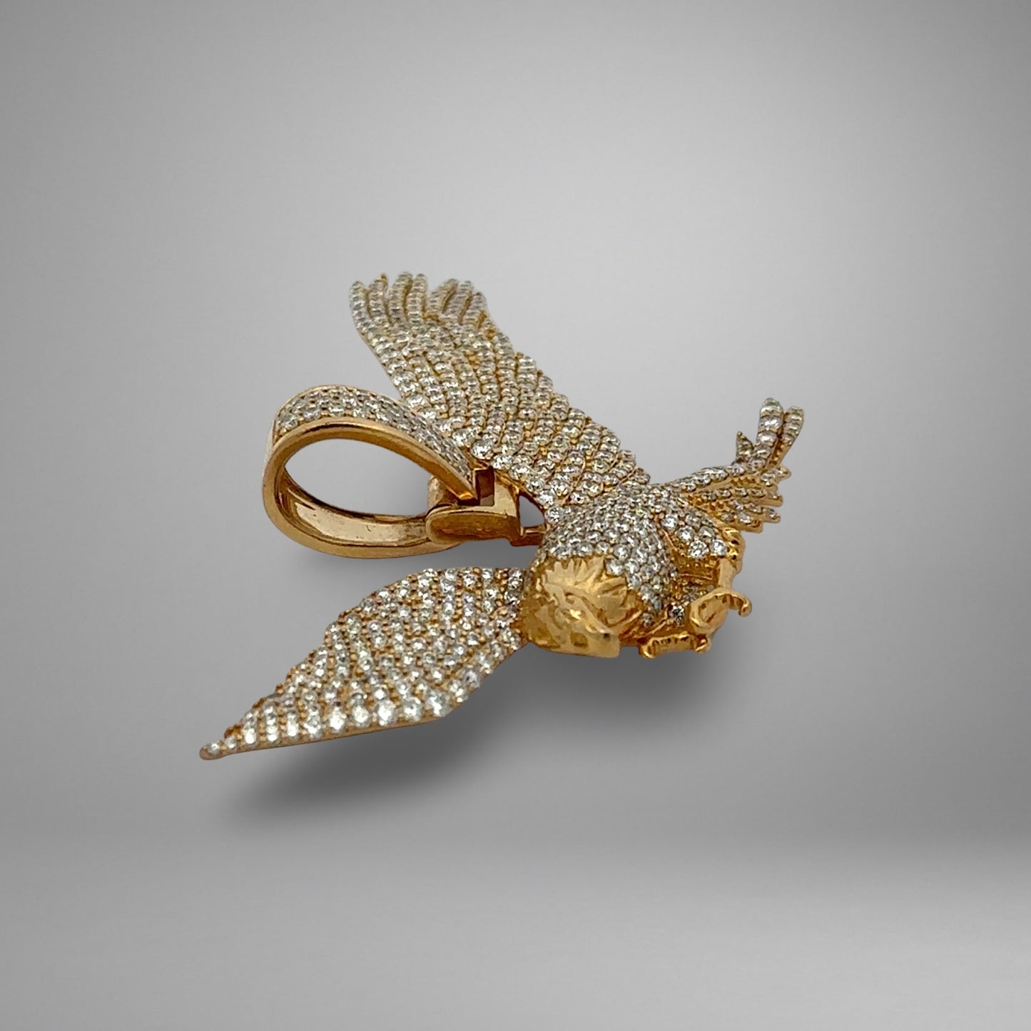 Gold and diamond eagle pendant